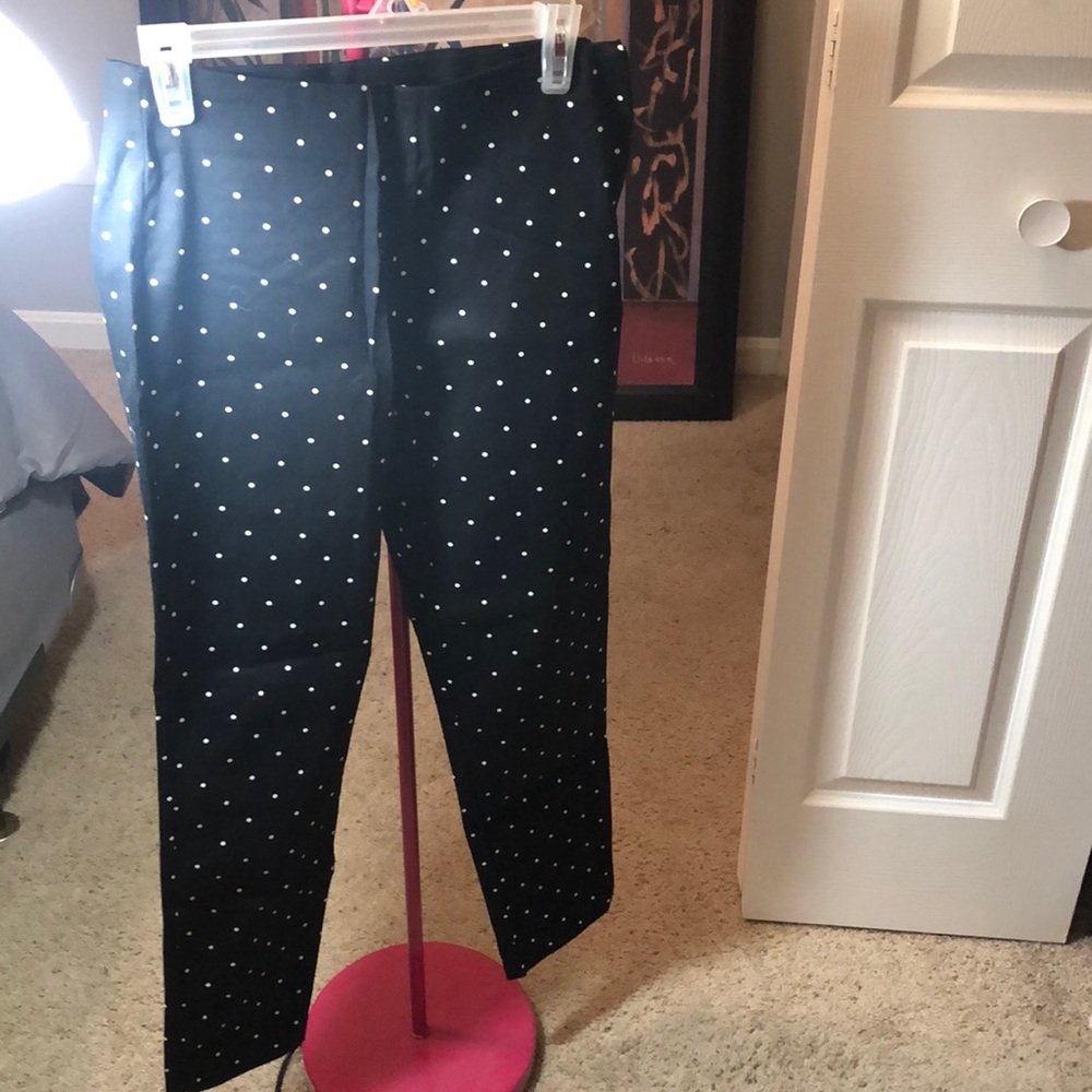 Black and white polka dotted pants.